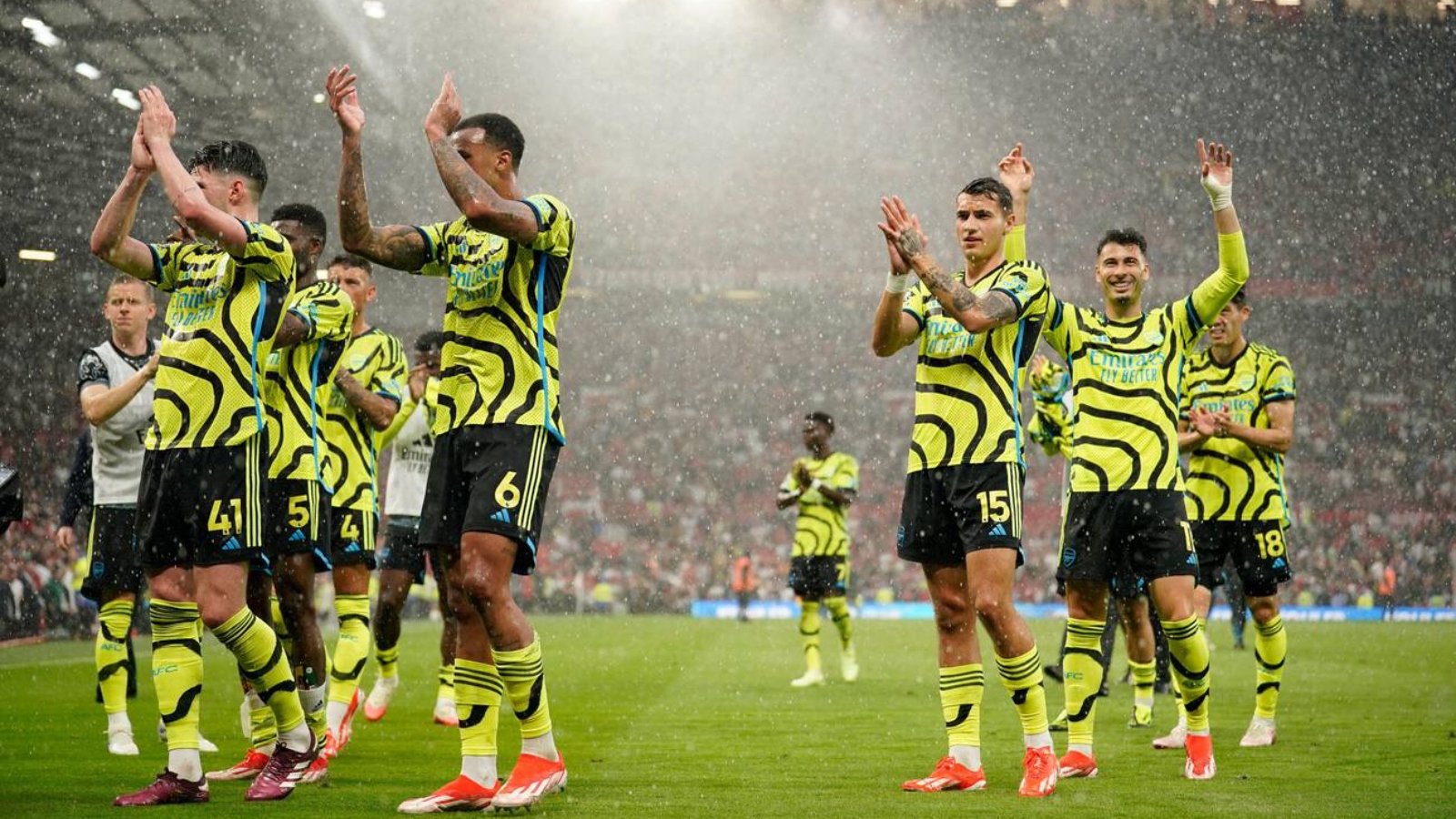 Arsenal's players celebrate after winning the English Premier League soccer match between Manchester United and Arsenal at the Old Trafford Stadium in Manchester, England, Sunday, May 12, 2024. Arsenal won 1-0