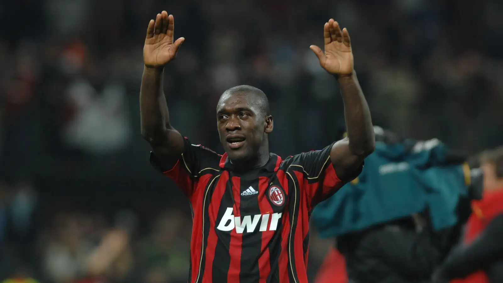 AC Milan midfielder Clarence Seedorf salutes the home fans after victory over Manchester United took them into the UEFA Champions League final. San Siro, Milan, Italy, May 2007.