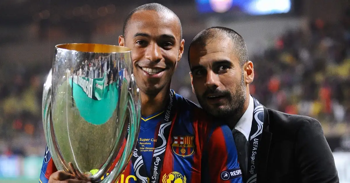 Barcelona's coach Josep Guardiola and Thierry Henry hold the trophy after the UEFA SuperCup Europa League Soccer Match FC Barcelona vs FC Shakhtar Donetsk at the Louis II Stadium in Monaco. 28 August 2009.