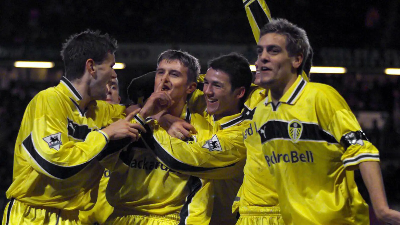 Stephen McPhail gestures to the Chelsea fans to be quiet as he celebrates his 2nd goal which puts Leeds United top of the league during their FA Premiership match at Stamford Bridge.