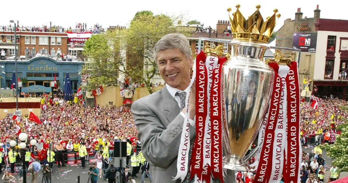 Arsene Wenger holds the Premier League trophy during Arsenal title parade in 2004.