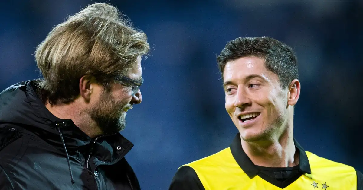 Jurgen Klopp and Robert Lewandowski smile after the UEFA Champions League match between Zenit St. Petersburg and Borussia Dortmund at Petrowski stadium. February 2014.