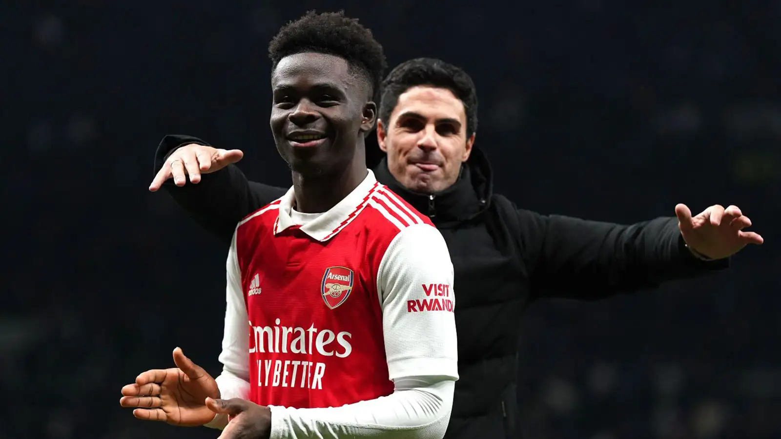 Arsenal's Bukayo Saka (left) celebrates with manager Mikel Arteta following victory in the Premier League match at the Tottenham Hotspur Stadium, London. Picture date: Sunday January 15, 2023.